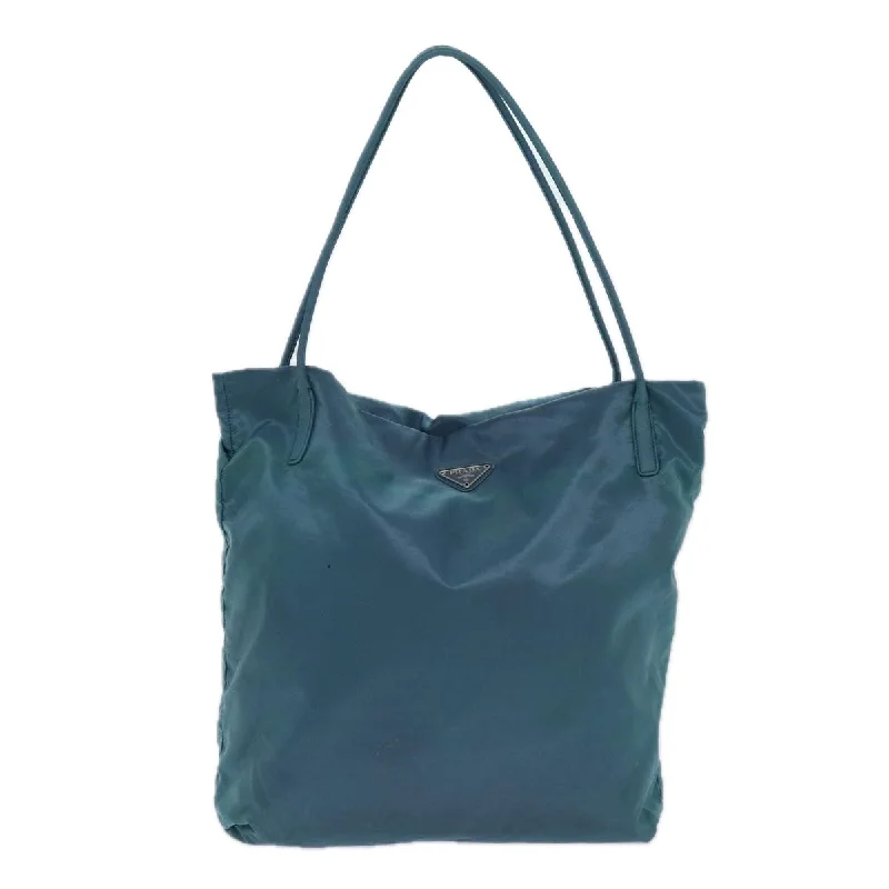 Prada Cleo bags with a contrast - colored interior for visual interestPRADA Tessuto Tote