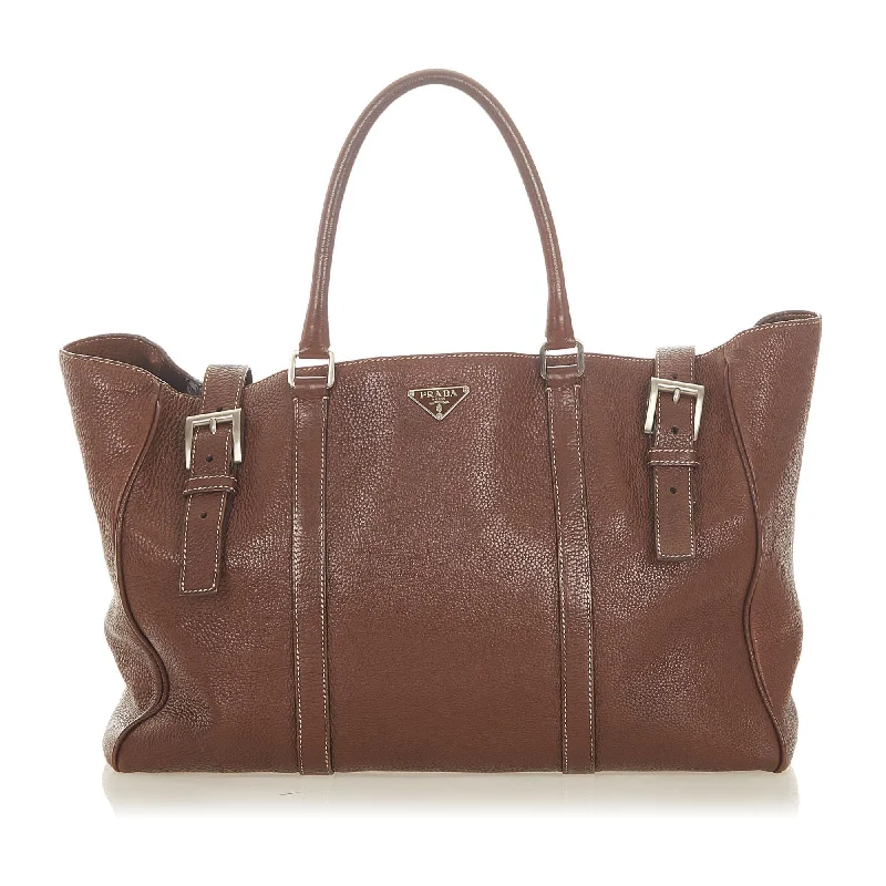 Prada handbags with a patent - leather finish for a shiny and sophisticated appearancePrada Leather Tote Bag (SHG-19271)