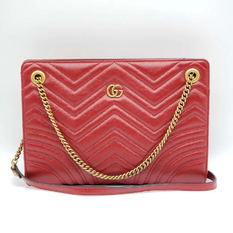 Women Gucci bags with a front - zip pocket for small itemsWomen Gucci bags with a front - zip pocket for small itemsGucci GG Marmont Quilted Clutch Shoulder Bag