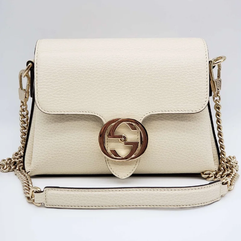 Women Gucci bags with a snap - button closure and a decorative charmWomen Gucci bags with a snap - button closure and a decorative charmGucci GG Interlocking Small Shoulder Bag