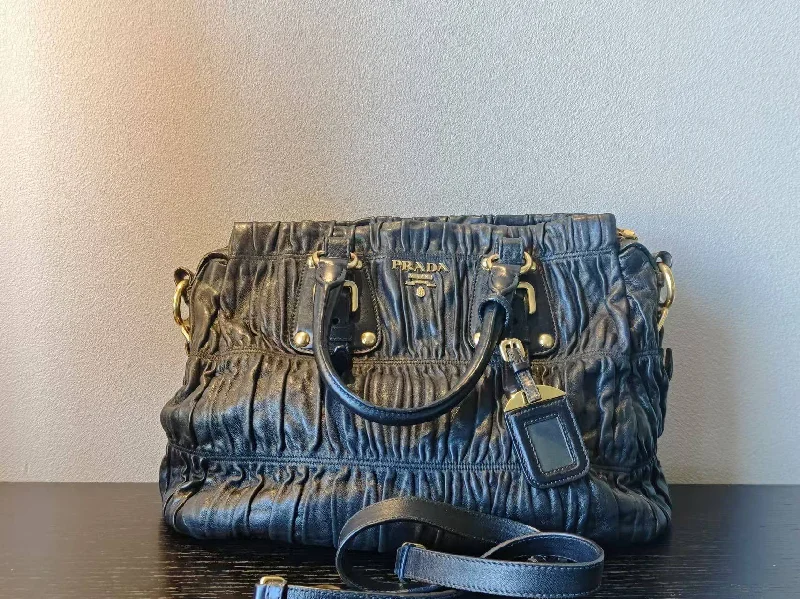 Ladies Prada handbags with a detachable wallet inside for added conveniencePrada Black Two-Way Leather Bag Medium