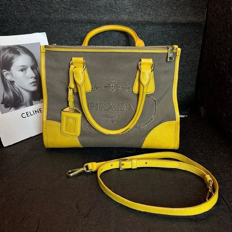 Prada bags with a snap - button closure and a decorative charm for a fashionable lookPrada Yellow Canvas Leather Patchwork Shoulder Handheld Bag 31.5cm