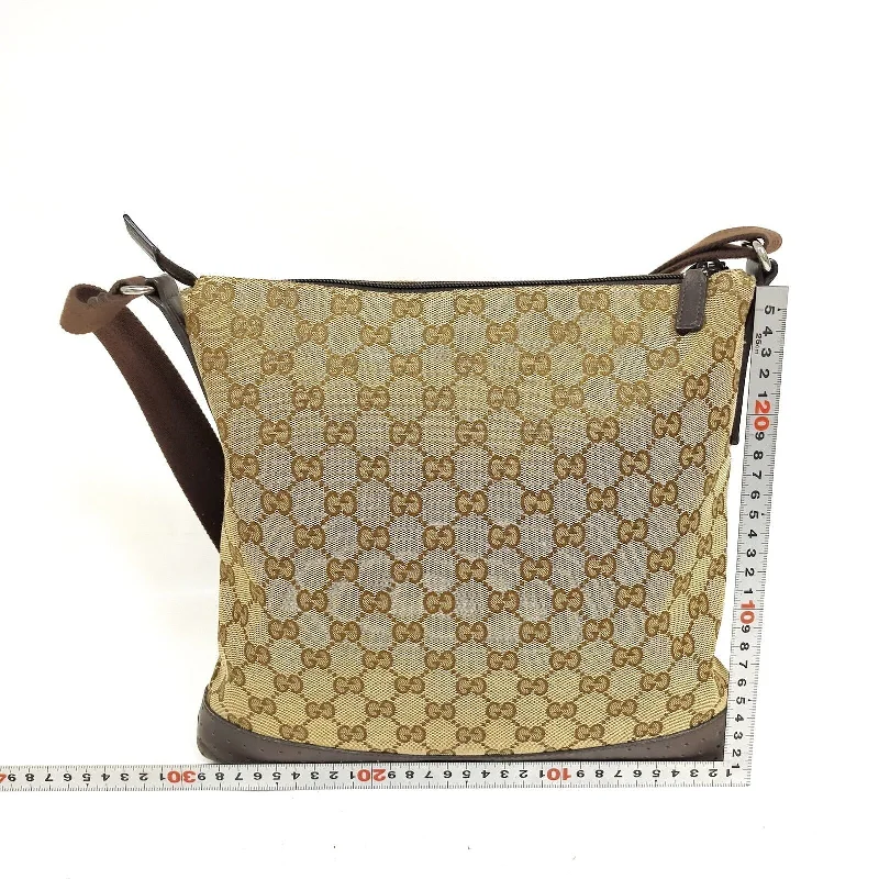 Ladies Gucci handbags with a detachable coin purse insideLadies Gucci handbags with a detachable coin purse insideGucci  Brown Canvas Crossbody Bag