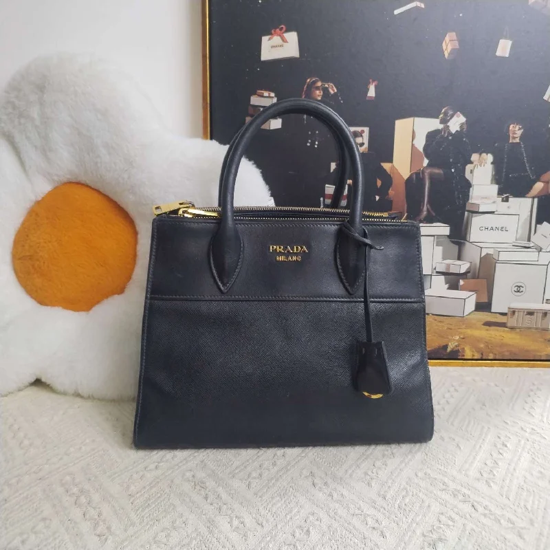 Ladies Prada Re - Edizione 2005 bags with a star - shaped charm for a playful touchPrada Black Saffiano Leather Double Handle Tote Bag