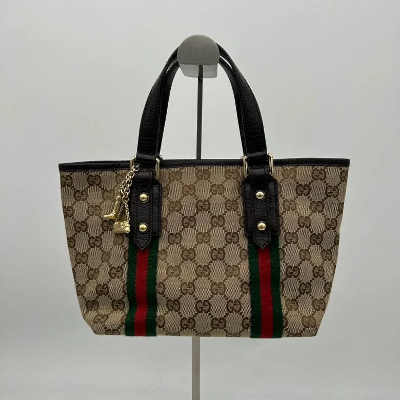 Women Gucci Sylvie bags with a detachable ribbon detailWomen Gucci Sylvie bags with a detachable ribbon detailGucci Beige Canvas GG Monogram Tote Bag with Black Leather Trim Medium