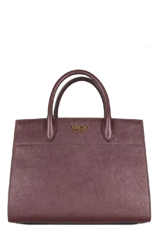 Prada Cahier bags with a monogram - embossed leather surfacePrada Maroon Small City Biblioteque Tote Burgundy Saffiano Leather Shoulder Bag