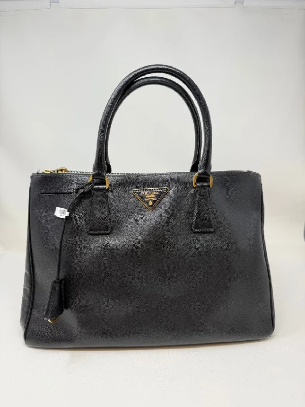 Ladies Prada Re - Edizione 2005 bags in a pastel color for a soft lookPrada Black Leather 2 Way Bag Medium