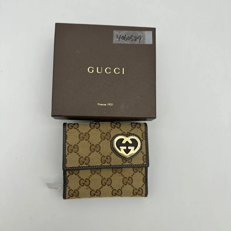 Ladies Gucci Dionysus bags in a pastel colorLadies Gucci Dionysus bags in a pastel colorGucci Beige Canvas GG Logo Clutch Wristlet With Heart Closure