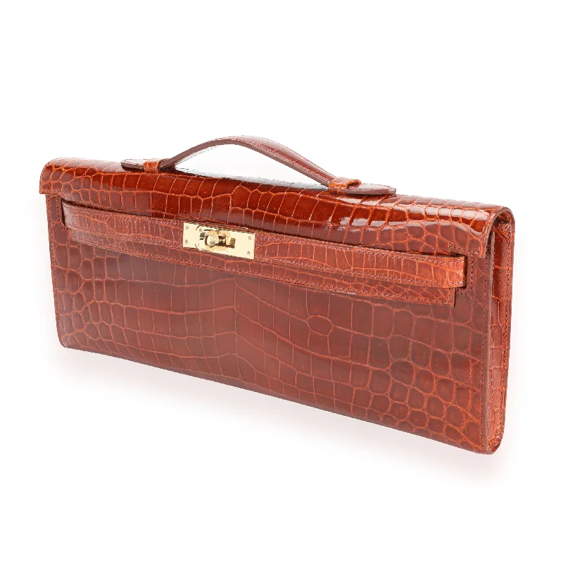 Hermès Kelly Bags in a metallic silver for a glamorous touchHermès Miel Shiny Niloticus Crocodile Kelly Cut GHW