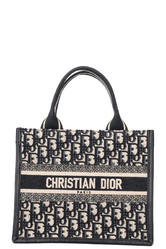 Christian Dior Saddle bags with a studded trim for a bold lookCHRISTIAN DIOR Book Tote Oblique Small