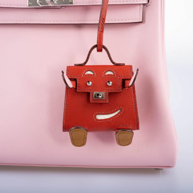 Hermès Kelly Bags in a neutral camel color for a versatile styleHermès Micro Kelly Quelle Idole Bag Charm Rose Sakura, Sanguine, Nata, Sesame, Tadelakt and Chevre Mysore Palladium Hardware