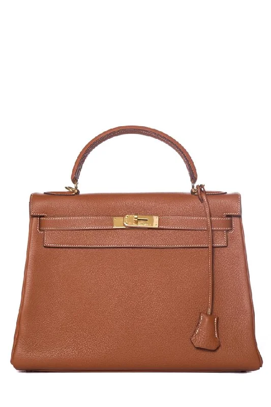 Hermès Kelly Bags with a quilted leather exterior for a luxurious feelHermès Kelly 28 Cm Retourne Taurillon Gold Clemence Leather Tote