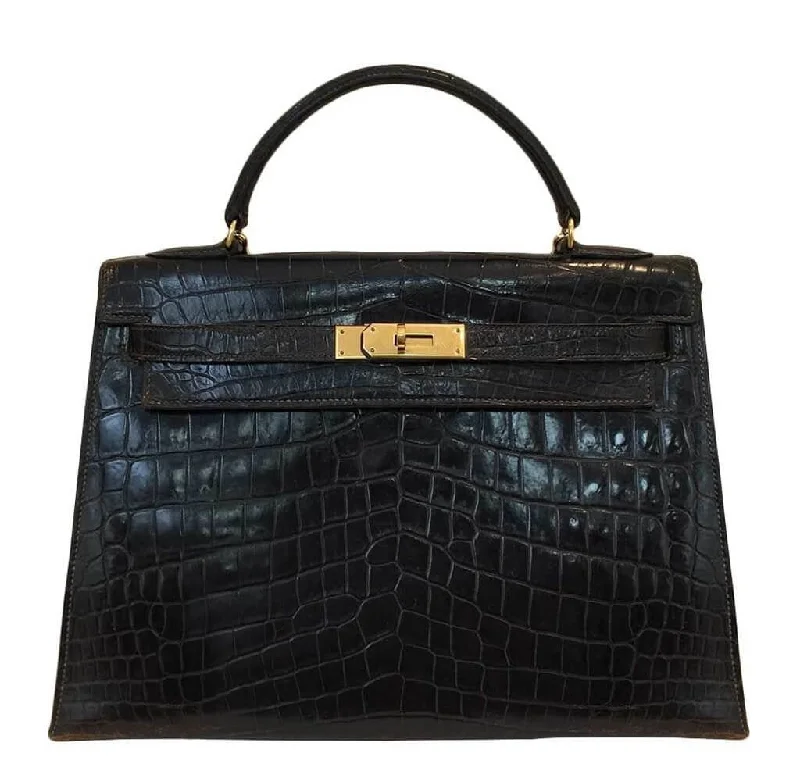 Hermès Kelly Bags in a deep indigo blue for a classic and sophisticated lookHermès Vintage Kelly 32 Bag Cocaon Crocodile