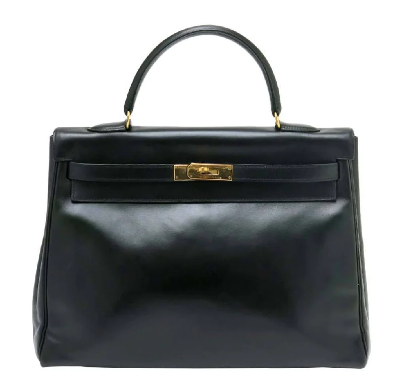 Hermès Kelly Bags with a two - tone leather design for visual interestHermès Kelly 35 Black Box Calf Bag GHW