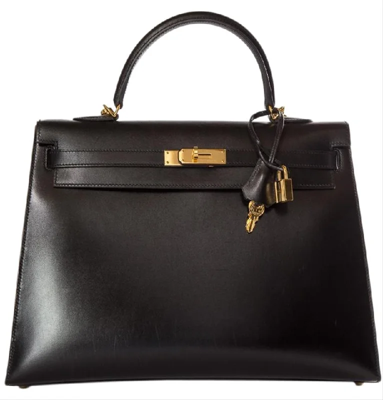 Hermès Kelly Bags with a detachable shoulder strap for versatilityHermès Kelly 35cm Sellier Swift Handle Black Leather Tote