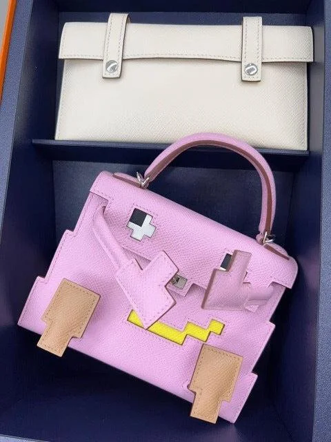 Hermès Kelly Bags with a chain - embellished handle for a modern twistHermès Kelly Doll Quelle Idole Picto Mauve and Chai Palladium Hardware