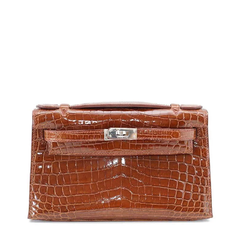 Hermès Kelly Bags with a magnetic - snap closure for easy accessHermès Kelly Pochette Mini Crocodile Miel Bag